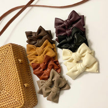 Load image into Gallery viewer, Faux leather &amp; suede bows
